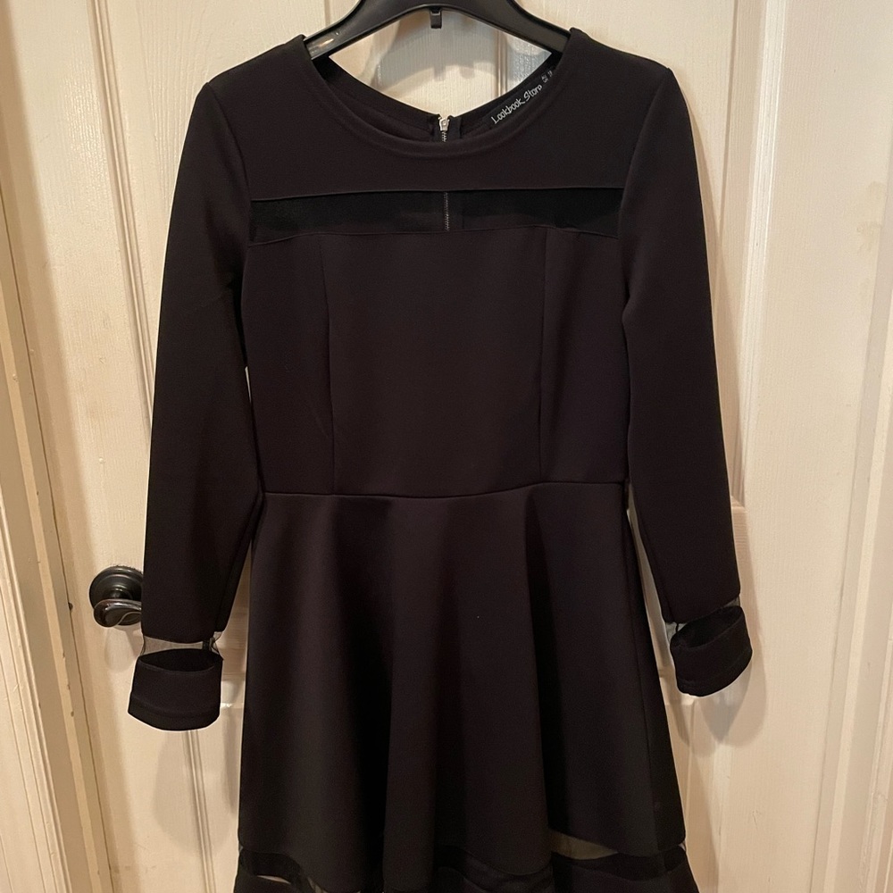 Women’s black long sleeve dress. Work once.